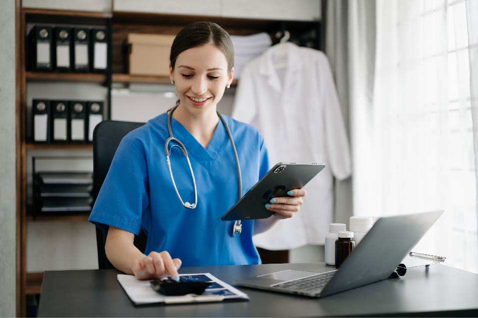 Image of doctor holding a tablet showing data on the screen